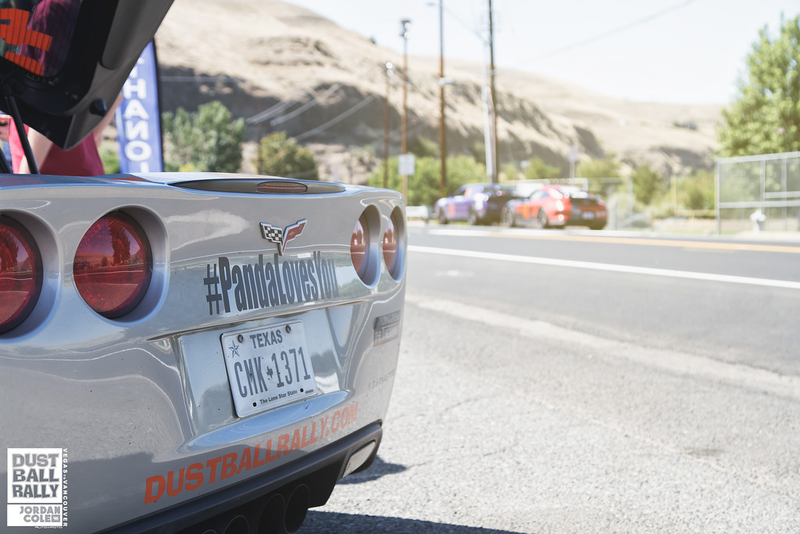 Photo Credit: Jordan Cole; Cropped out: four guys under the hood